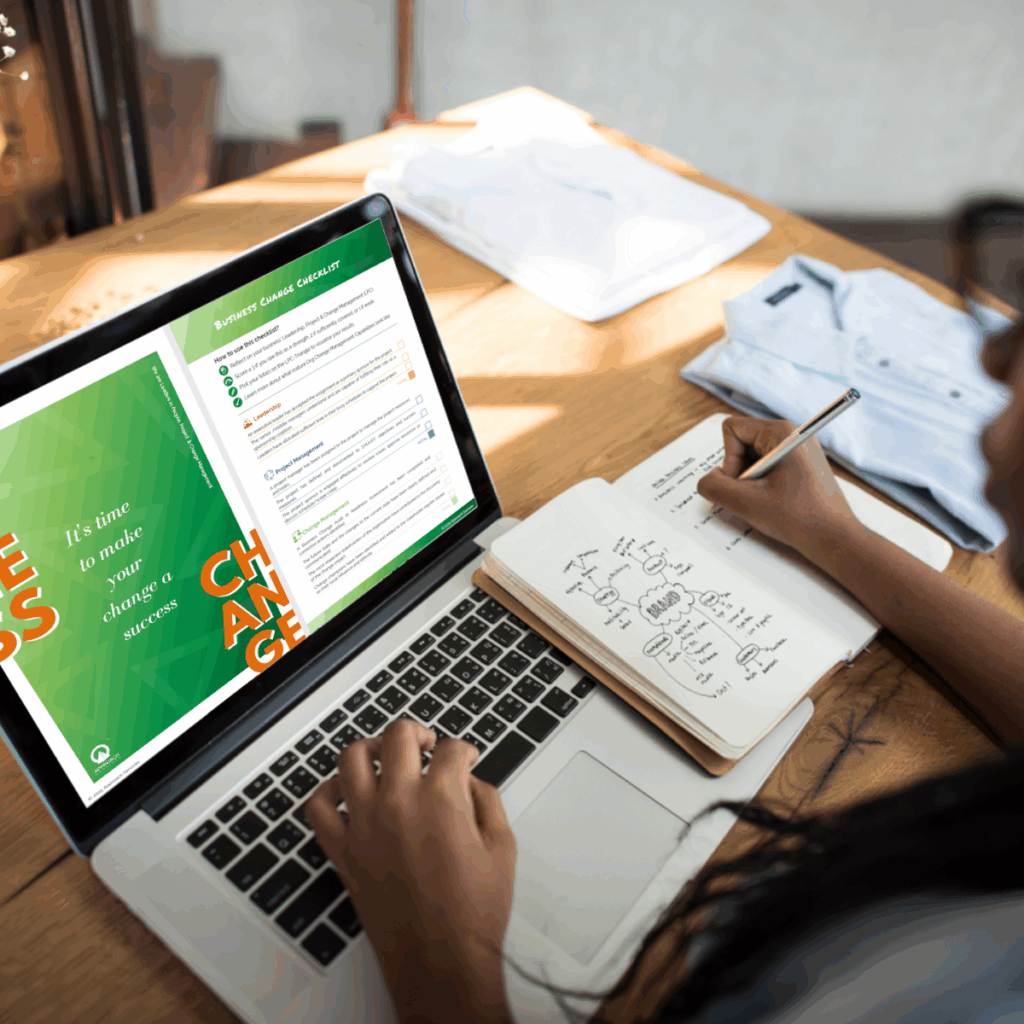 Free Business Change Checklist - Change Leaader using the checklist on her laptop